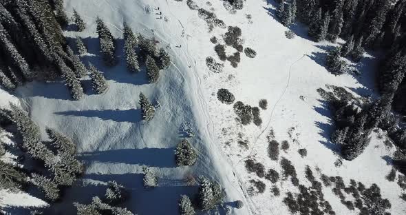 A Man Is Walking on a Snowy Slope