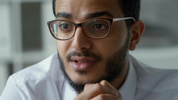 Close Up of Middle Eastern Businessman Talking with Colleagues