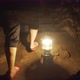 A Woman with a Kerosene Lamp Lantern Goes Inside a Cave, Climbs Stone Steps. - VideoHive Item for Sale