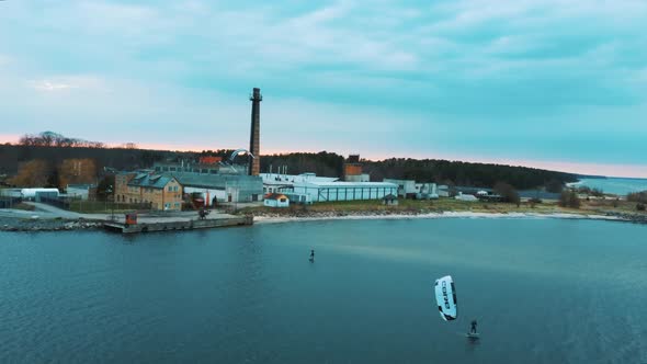 Aerial Drone View of a Corekites Kitesurfers Hydrofoiling  in Engure Port at in Baltic Sea