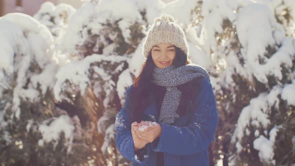 Woman Throws Snowball Hitting Camera. Slow Motion  Hogh Quality Sharp Footage