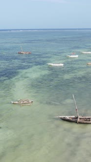 Vertical Video Boats in the Ocean Near the Coast of Zanzibar Tanzania