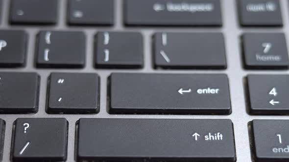 Enter Button Long Pressing a Lot of Times on Keyboard Laptop Keyboard Close Up