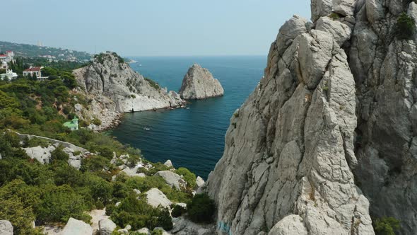 Aerial Close Fly Behind Rock Krylo Lebedya  Swan Wing with Diva Rock and Black Sea in Background