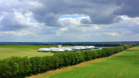 Storage and production of biogas, Aerial view of big biogas plant in green fields