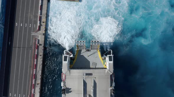 Modern ferry ship docking in port for loading and unloading