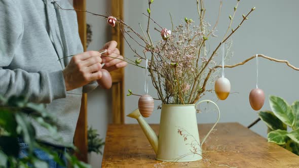 Woman Decorating Easter Floral Arrangement DIY Easter Home Decor