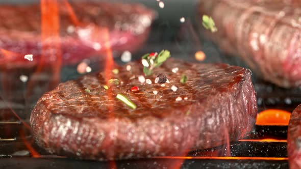 Super Slow Motion Shot of Seasoning Falling on Fresh Grilled Beef at 1000 Fps