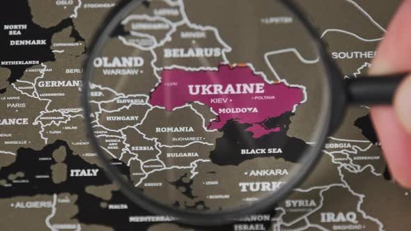 Ukraine on the World Map Under Magnifying Glass