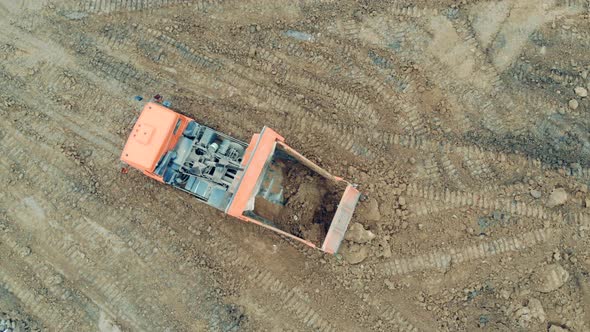 Truck Is Unloading Soil at the Quarry Site