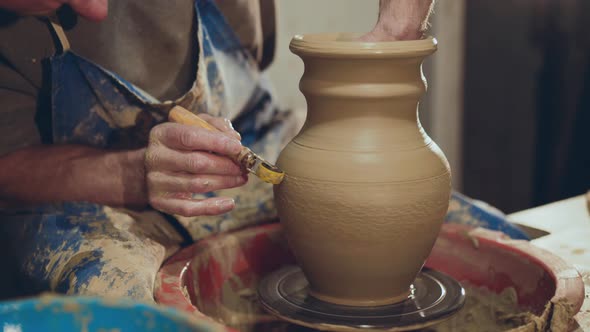 The Potter Making Pattern on Clay Vase Using Tool for It