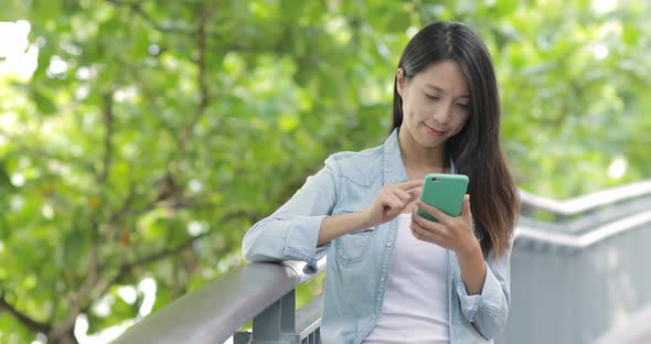 Woman use of smart phone at outdoor 