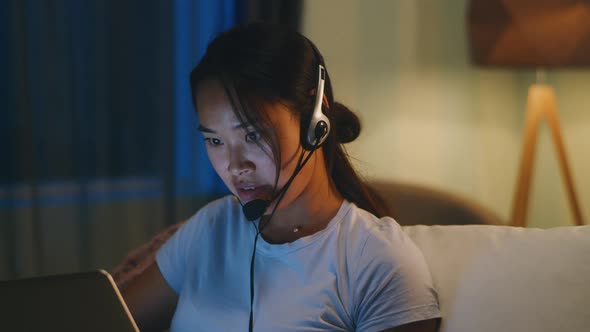 Asian Mother Making Video Call at Night