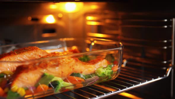 Food Cooking in Baking Dish in Oven at Home