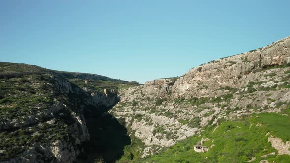 AERIAL: Panoramic View of Canyon of Magrr Ix-Xini Bay with Greenery Growing on Steep Hills