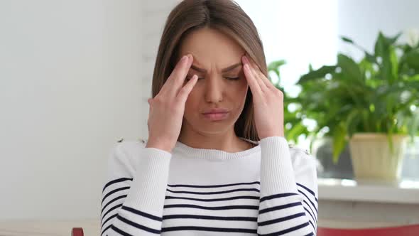 Beautiful Young Woman Gesturing Headache, Stress