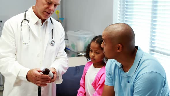 Male doctor prescribing medicine to patient