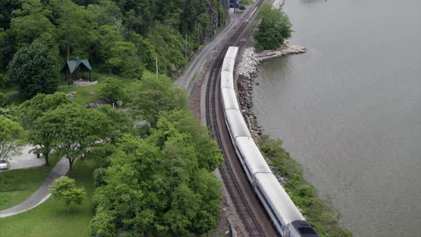 Flying Over Passing Train by the Hudson River