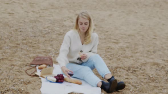 Pretty Woman Is Having Picnic On Beach