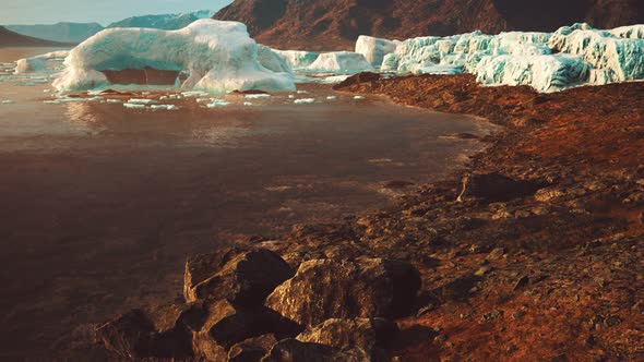 Antarctic Icebergs Near Rocky Beach