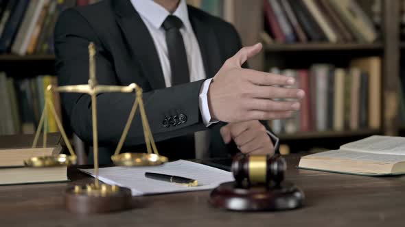 Close Up Shoot of Judge Hand Shaking Hand on Office Table