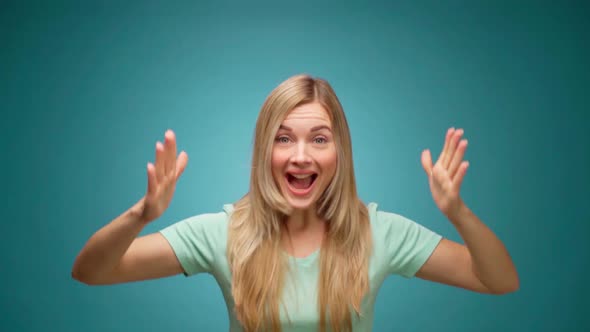 Portrait of Woman Shocked and Surprised with Good News