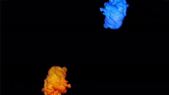 Slow Motion Shot of Blue and Yellow Ink on Black Background