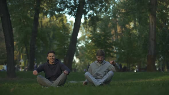 Two Friends Meditating in Central Park, Lotus Pose, Yoga Asana, Harmony Search