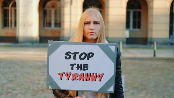 Young Woman Calling To Stop the Tyranny By Holding Steamer