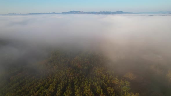 4K Drone Flying through the clouds at dusk or dawn. Aerial top cloudscape