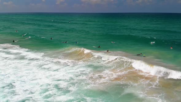 Surfers Surfing in Haifa Israel