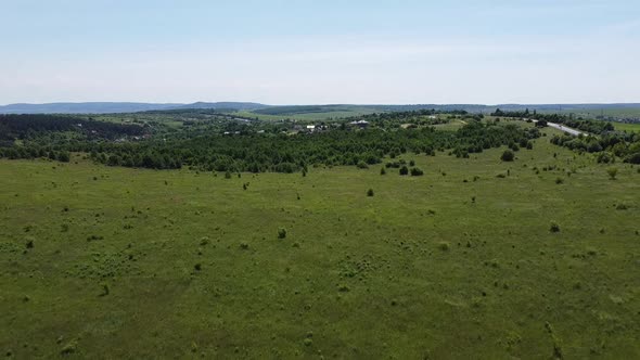 Aerial drone view of a flying over the rural agricultural landscape.