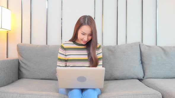 Young asian woman use laptop