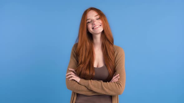 Redhead Woman with Freckles Dressed in Brown Tshirt and Cardigan