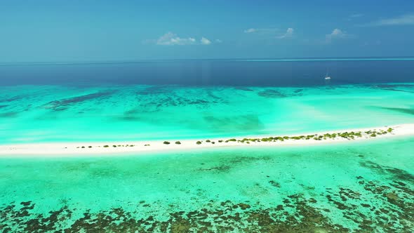 Wide angle drone abstract view of a sandy white paradise beach and aqua blue water background in hig
