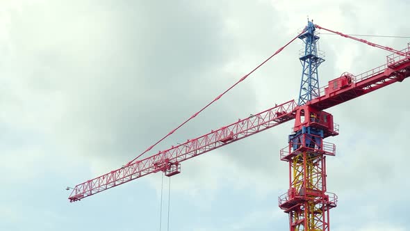 Big Industrial Tower Crane with Blue Sky on Background. Concrete Plates Weight Balance. High