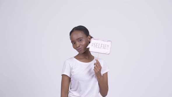 Happy Young African Woman Shouting Selfie with Selfie Paper Sign