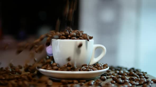 Coffee Beans Falling Into A Coffee Cup