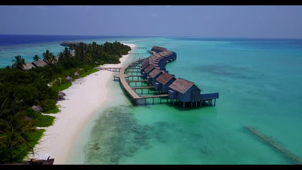 Aerial above sky of idyllic sea view beach vacation by turquoise ocean with white sandy background o