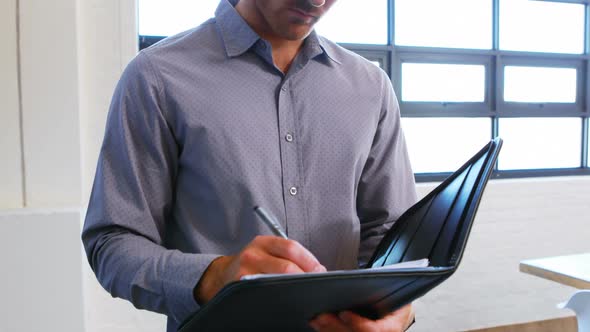 Businessman signing the document