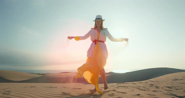 }Attractive Girl Taking Sand in Hands