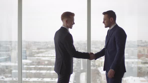 Businessmen in Suits Shaking Hands