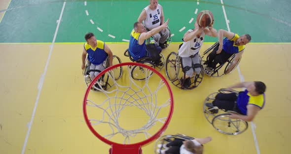 Top View Shot of Persons with Disabilities Playing Basketball in the Modern Hall