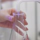 Close-up. The Laboratory Chemist Mixes the Recipes in a Volumetric Flask. COVID-19 Vaccine Research - VideoHive Item for Sale