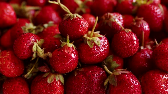 Red juicy and refreshing healthy strawberries, closeup, rotation. Natural delicious