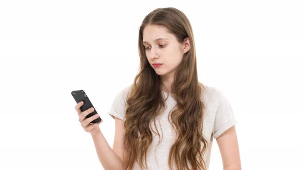 Portrait of Young Teen Woman Using Smartphone While Scrolling Social Media Feed and Searching for