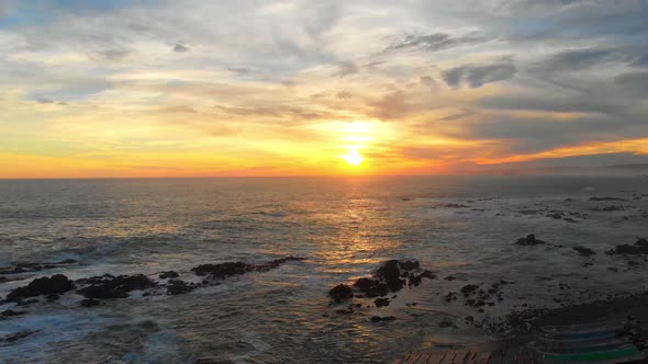 dramatic sunset along a rugged coastline