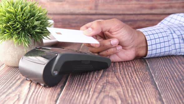 Contactless Payment Concept with Young Man Paying with Credit Card