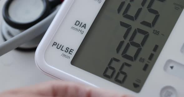 Woman Measures Arterial Blood Pressure on Automatic Blood Pressure Monitor  Movie