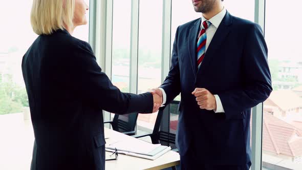 Business People Handshake with Friend at Office